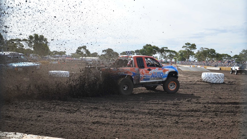 A truck sprays mud at Keith Diesel and Dirt Derby.