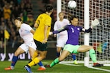 Caitlyn Foord scores past Chile's goalkeeper