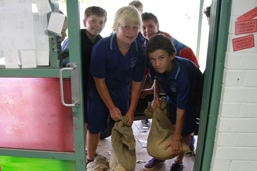 Students sandbag a classroom in Port Hedland