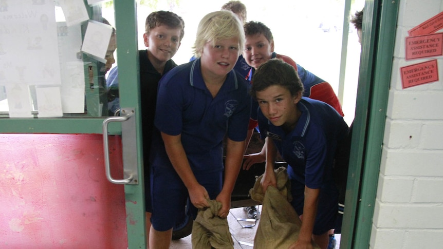 Students sandbag a classroom in Port Hedland