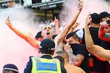 Western Sydney Wanderers fans let off flares at Docklands against Melbourne Victory in A-League.