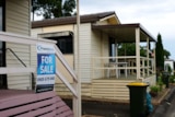 House with a for sale sign