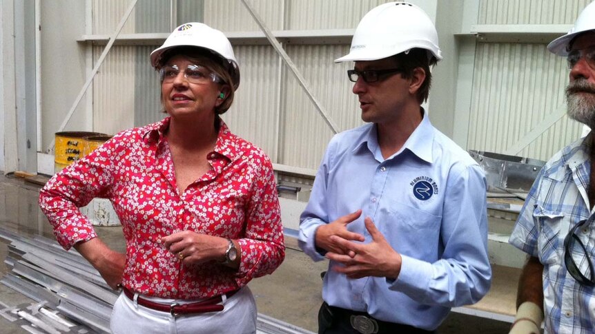 Ms Bligh gets a tour of a boat-building business at Hemmant on Brisbane's eastside on March 12.