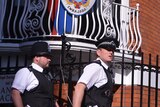 British policemen patrol outside the Ecuadorian embassy in London, where Julian Assange is seeking political asylum.