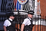 British policemen patrol outside the Ecuadorian embassy in London, where Julian Assange is seeking political asylum.