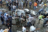 Emergency personnel gather at the site of explosions near the Iranian embassy in Beirut