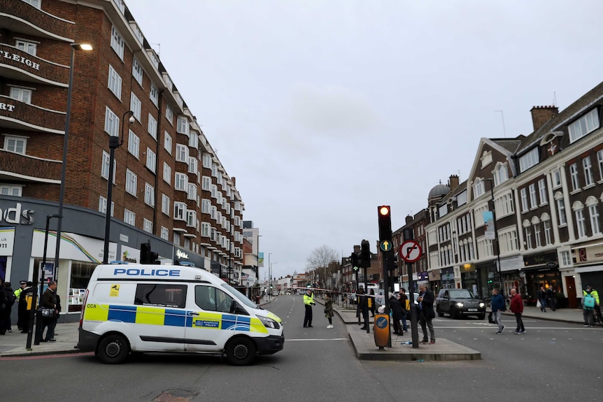 A police van parked in an urban street