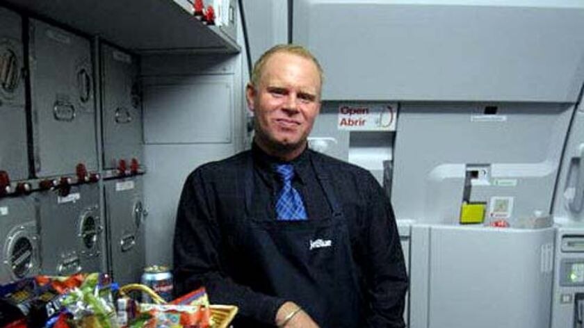 Rebel flight attendant Steven Slater stands in the galley of a jet