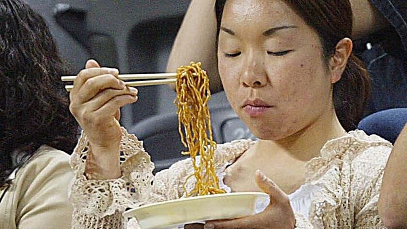 Japanese staple ... A woman enjoys a plate of Udon noodles (File photo)