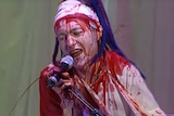 Jay Whalley from Frenzal Rhomb performs at the 1999 ARIA Awards in a hospital gown covered in fake blood