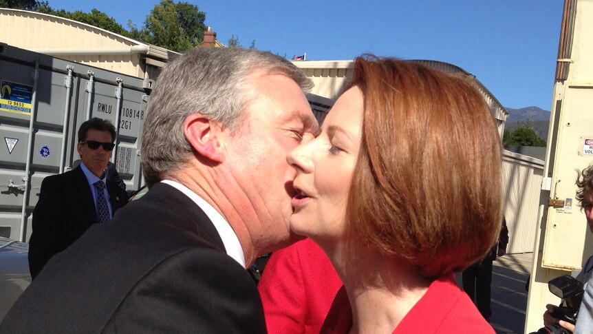 Tasmania's deputy Premier Bryan Green embraces Julia Gillard