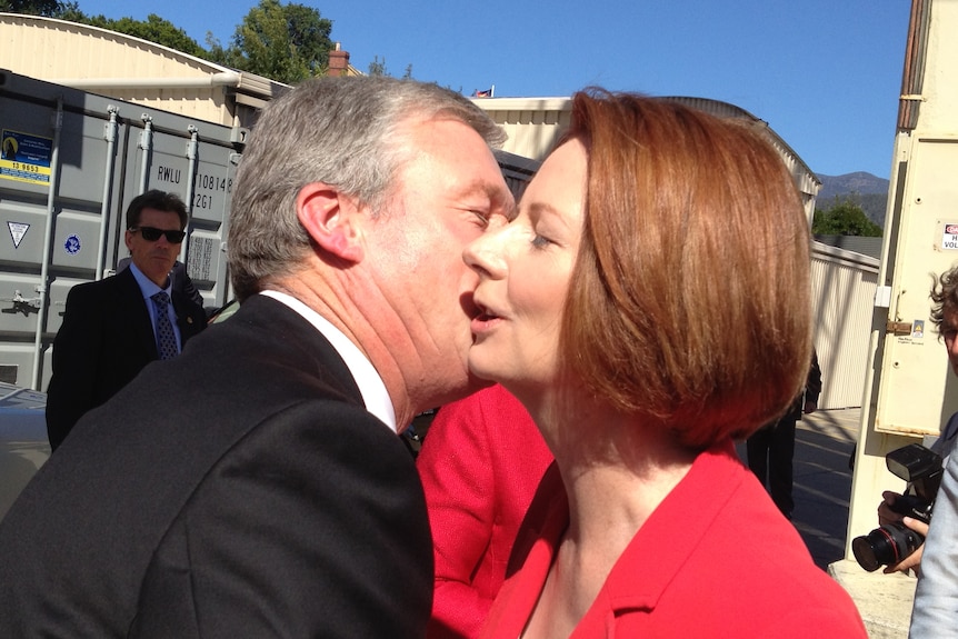 Tasmania's deputy Premier Bryan Green embraces Julia Gillard