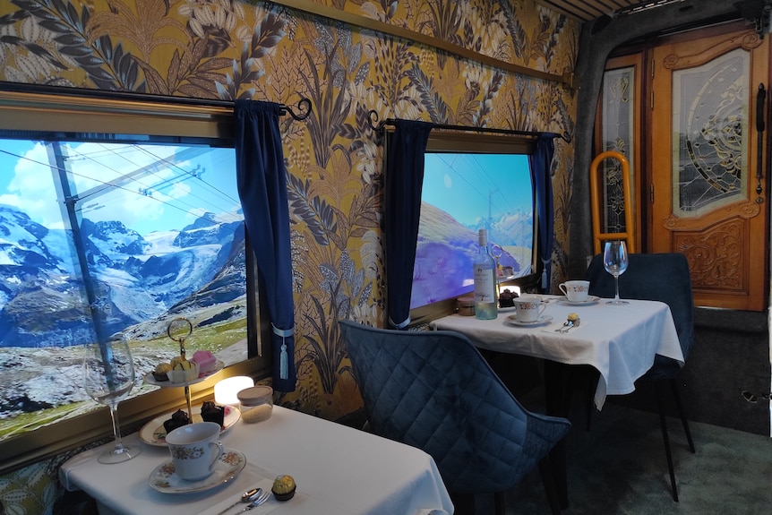 The interior of a van that has been refitted to resembled a luxury train carriage