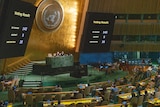 Monitors at the United Nations General Assembly hall display the results of a vote.