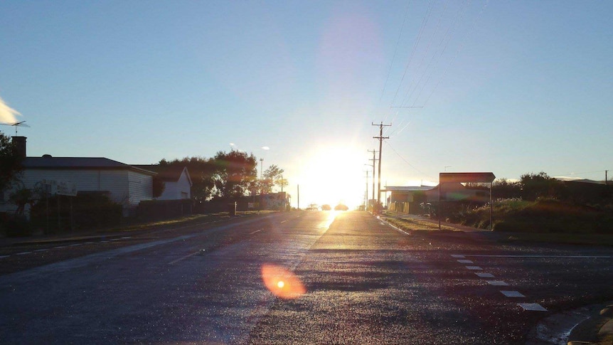 A quiet  country street at sunset.