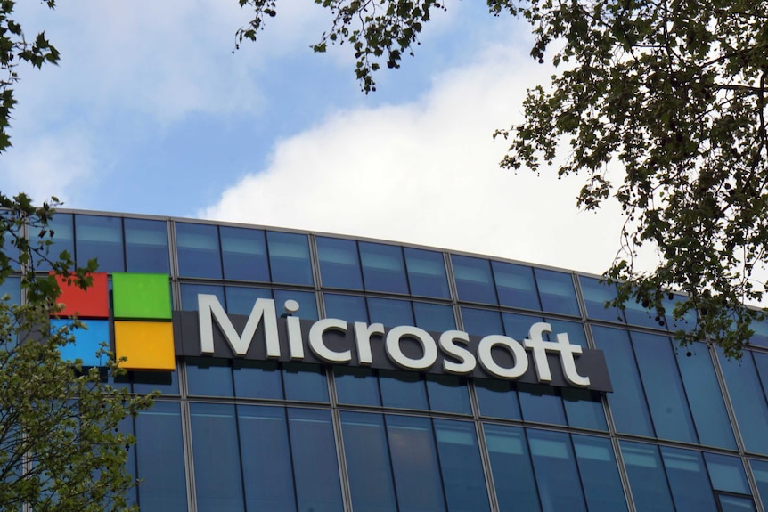 The French headquarters of Microsoft, in Issy-les-Moulineaux, outside Paris. The company logo is on the glass building.