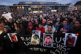 Dozens attend a vigil for the victims of a shooting in Hanau, near Frankfurt, Germany.