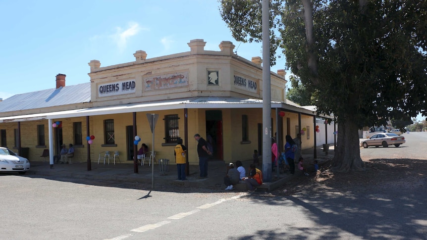 The Queen's Head Hotel with locals gathered outside during its opening as a gallery.