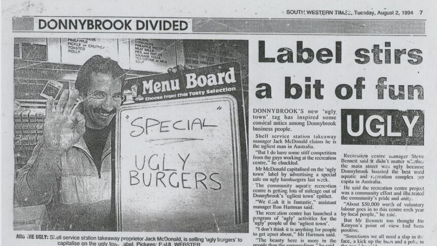A newspaper article from 1994 with a man holding a sign saying Ugly Burgers