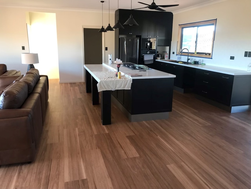 The kitchen and living room of a modern house