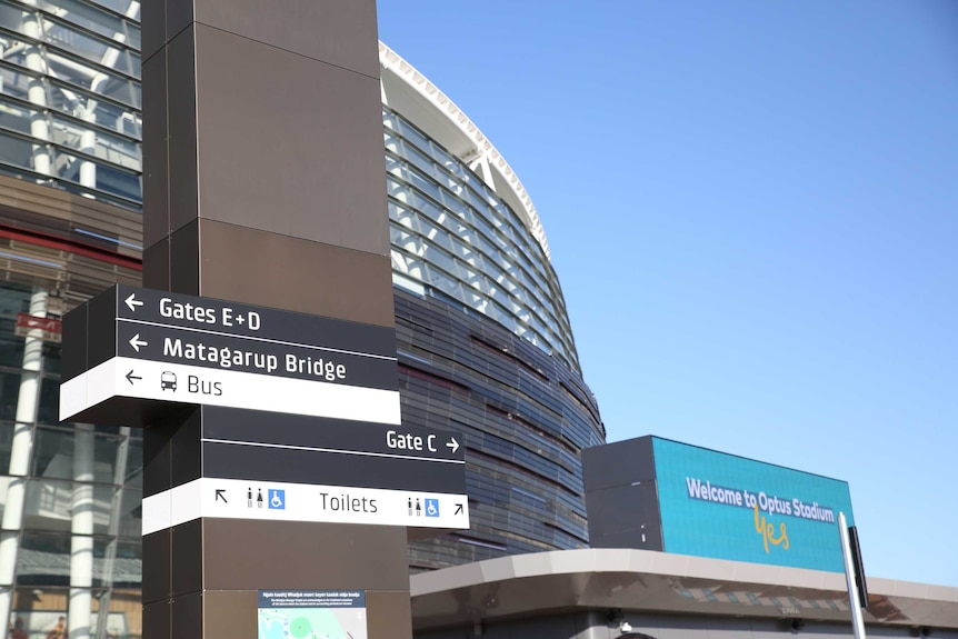 A sign outside Perth Stadium directing fans to gates, public transport, toilets and the Matagarup Bridge.