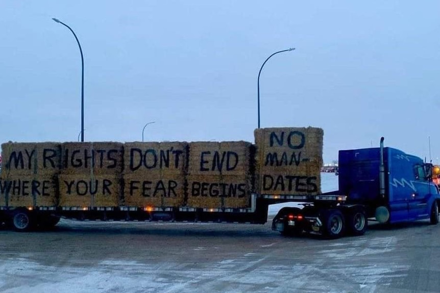 A truck with anti-vaccine mandate slogans painted on it
