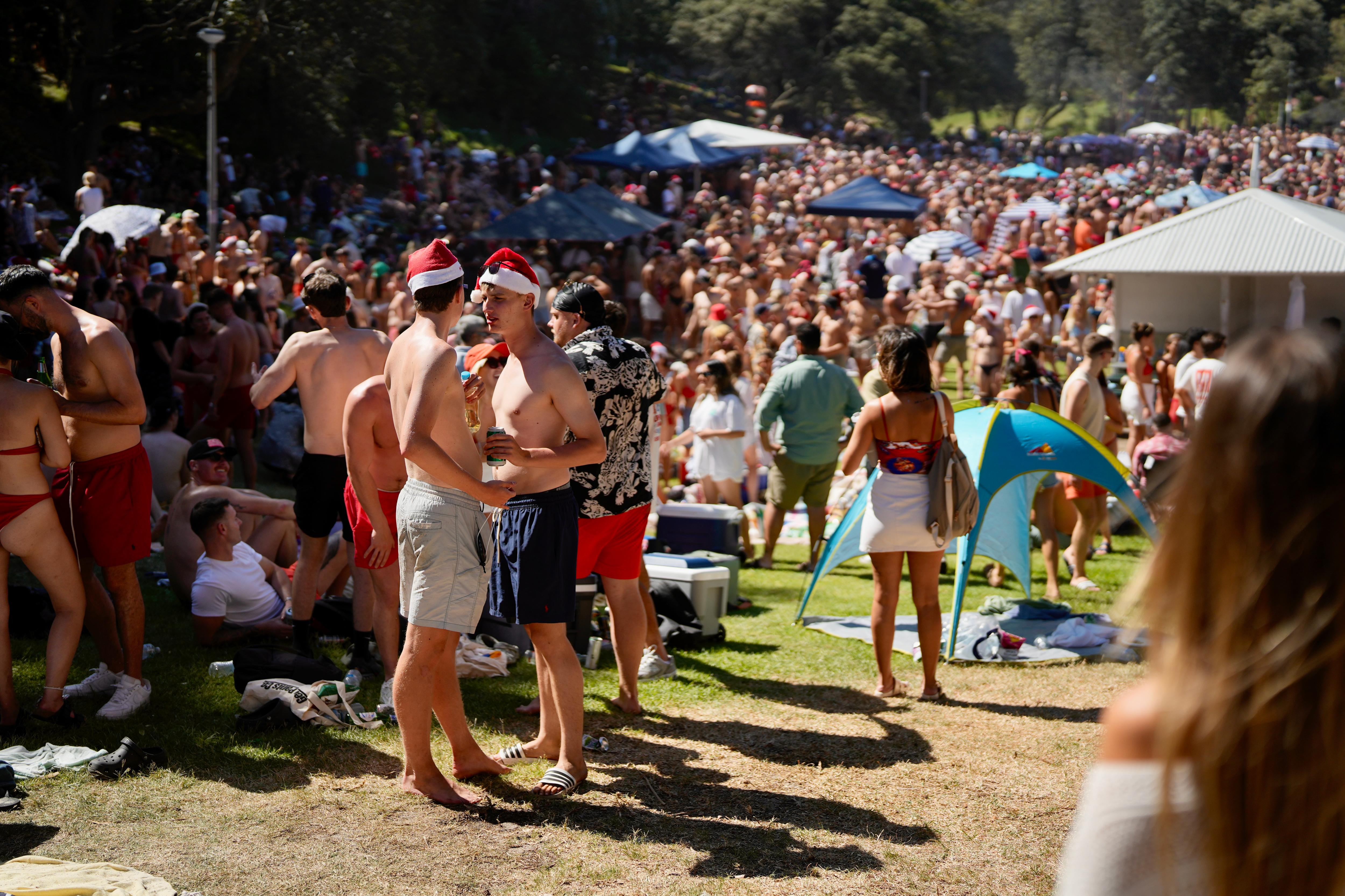Thousands pack Sydney's Bronte Beach for what has become known as the "orphan's Christmas"