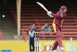 Usman Khawaja takes to the bowling in Queensland's one-dayer against Tasmania at North Sydney Oval
