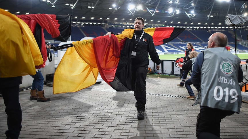 Police evacuate Hannover stadium before soccer friendly between Germany and Netherlands.