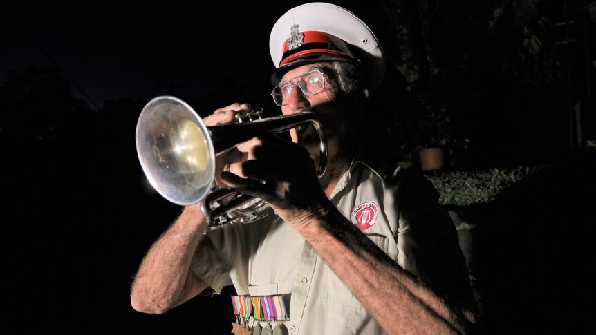 A man plays a trumpet