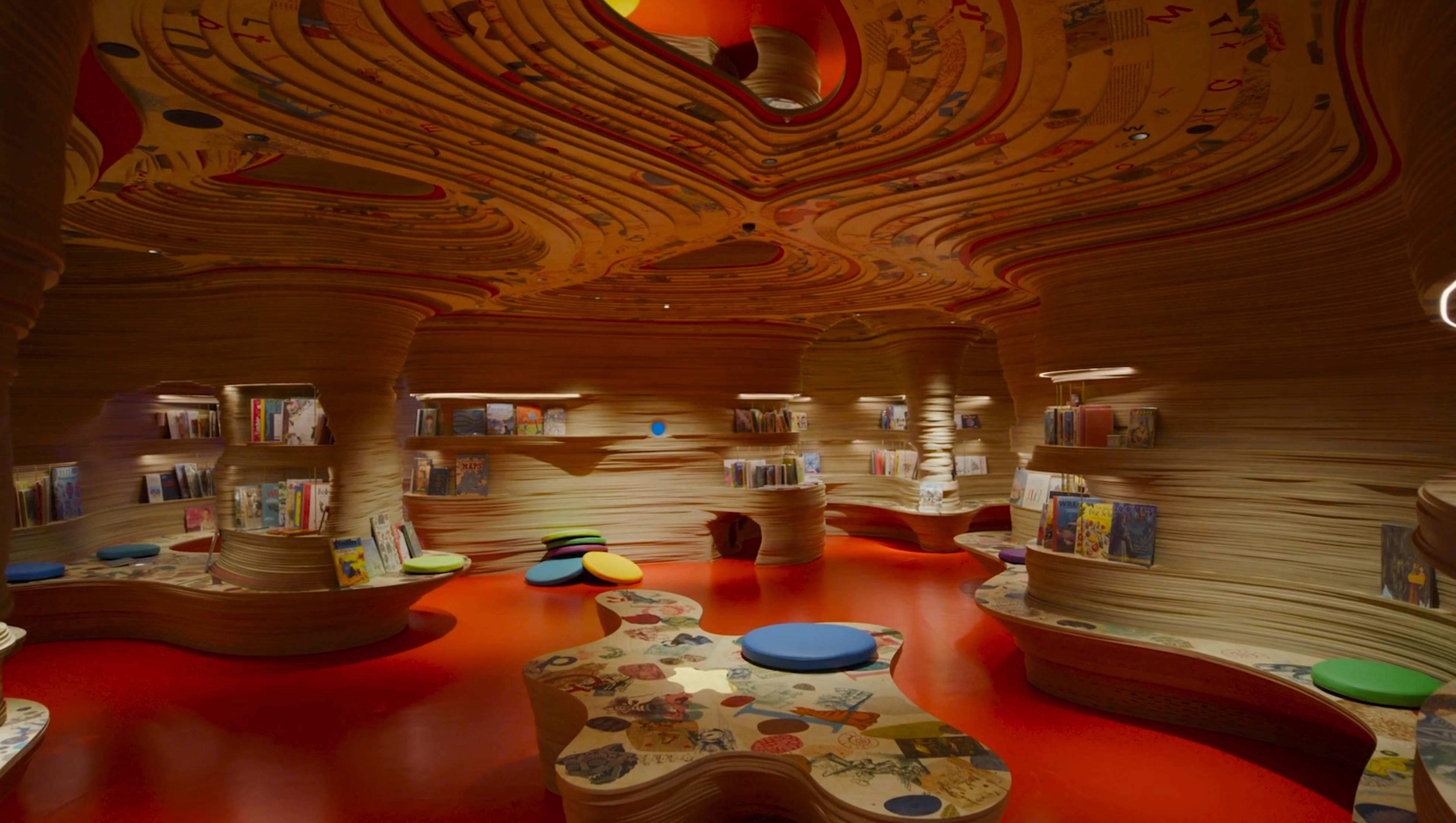 Room with curved seating and roof design.
