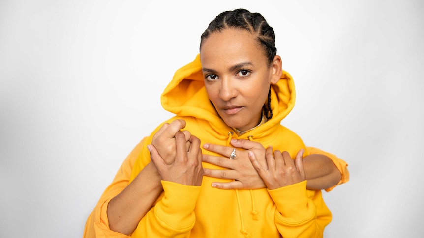 Headshot of Actress and musician Zindzi Okenyo in 2019 against a white backdrop.