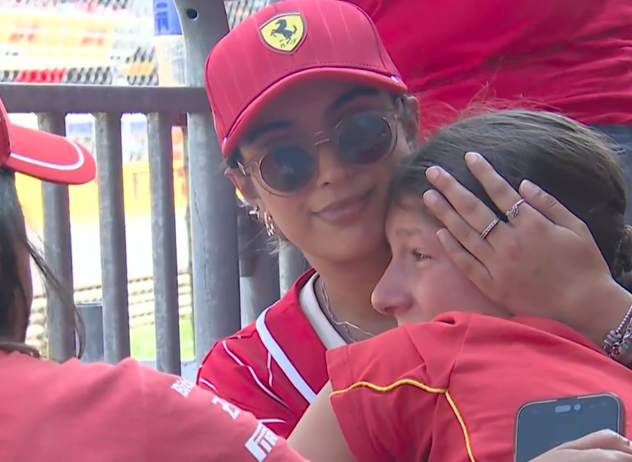 Woman crying, hugged and consoled by another woman