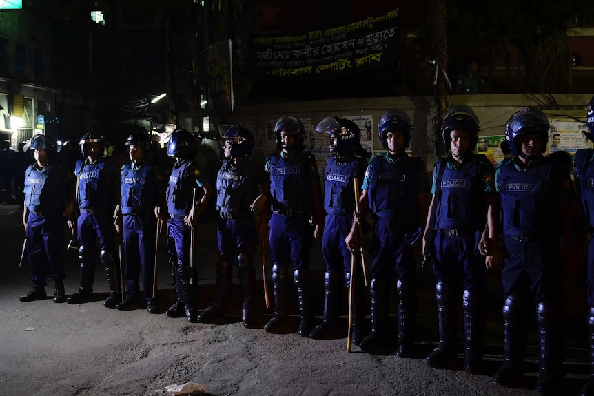 Bangladeshi security personnel stand guard outside a jail in Dhaka.