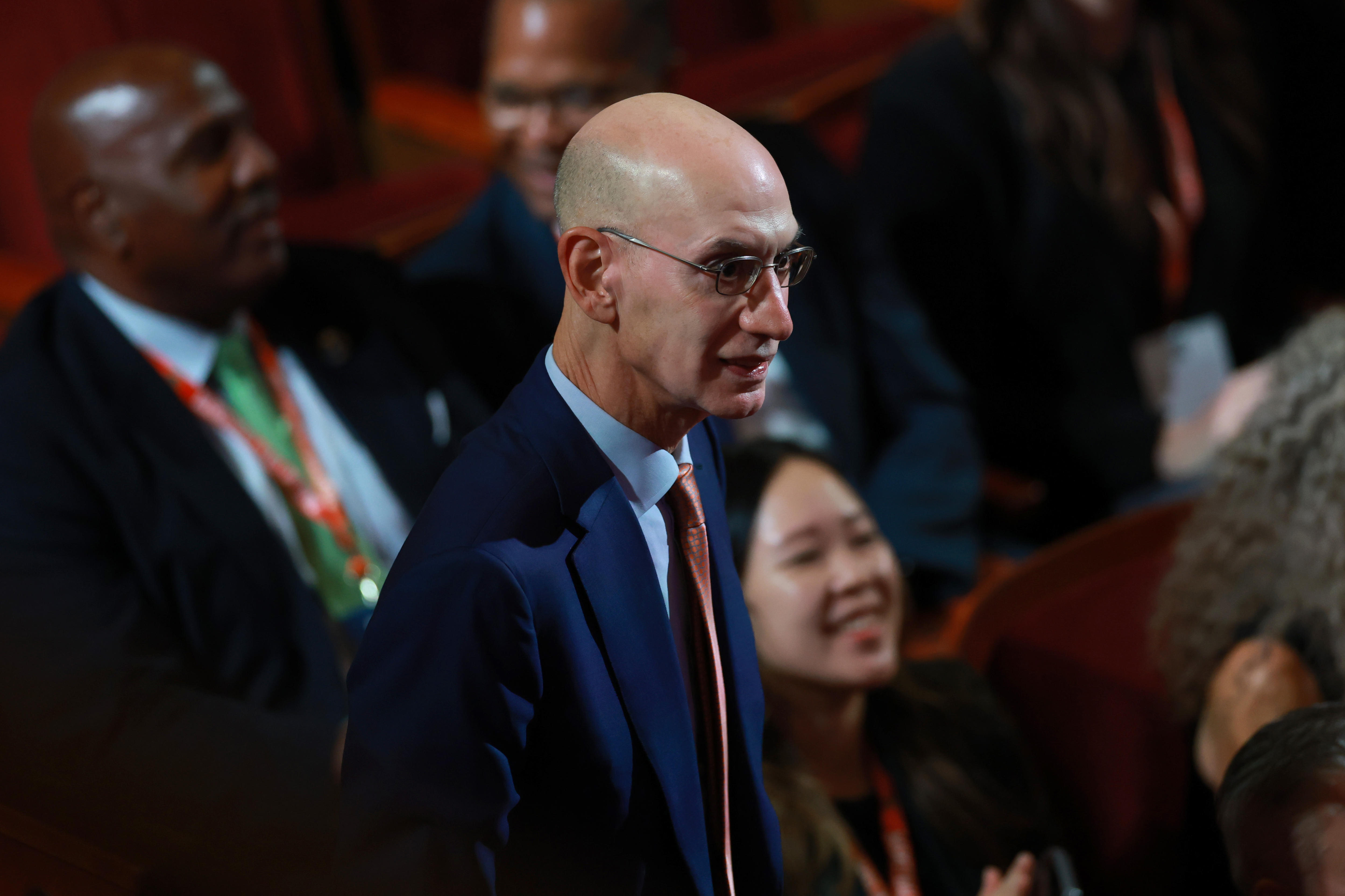 Adam Silver stands in a crowd