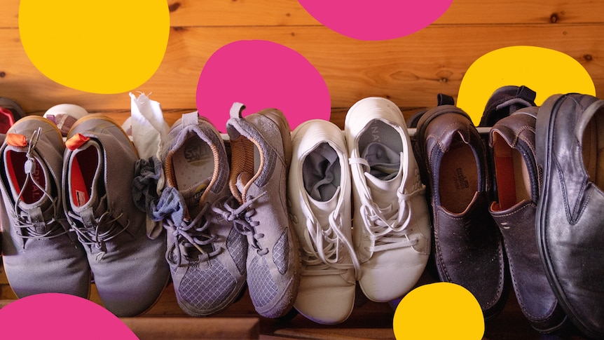 An overhead shot of a row of shoes, in a story about shoes on or off inside the home.