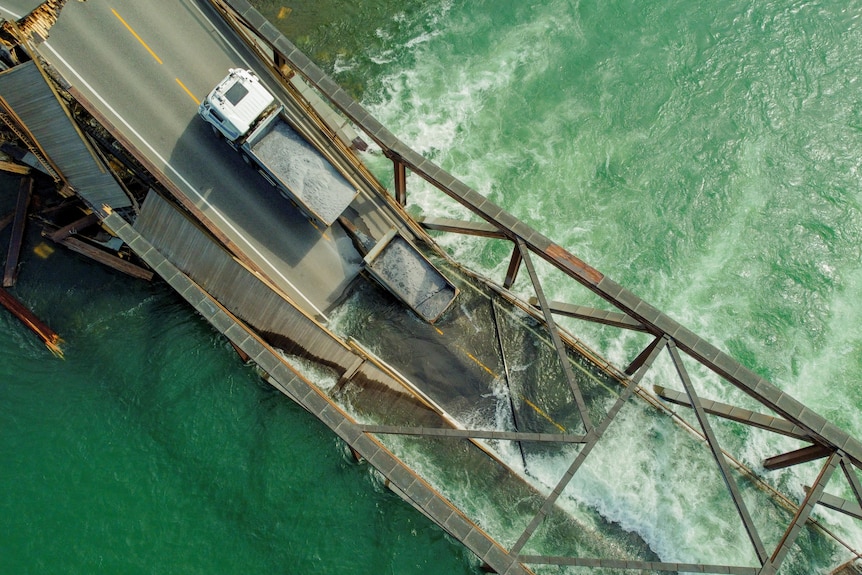 A drone image shows a truck stranded on the collapsed bridge near Tretten in southern Norway.