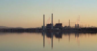 A view of Lake Liddell with the Liddell power station reflected in the background.