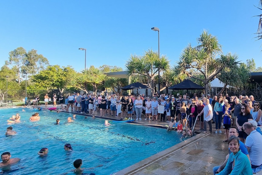 Residents gathered by the pool before the recreation facilities were closed