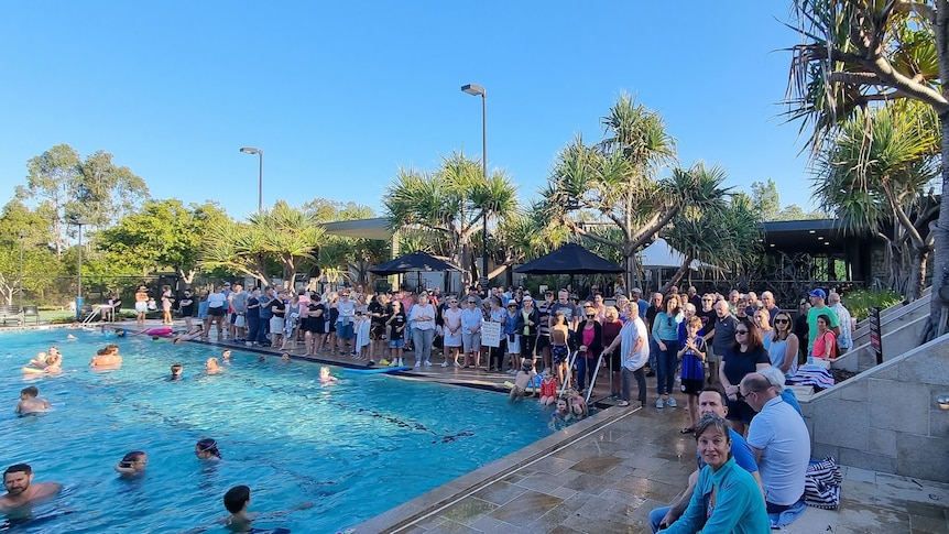 Residents gathered by the pool before the recreation facilities were closed