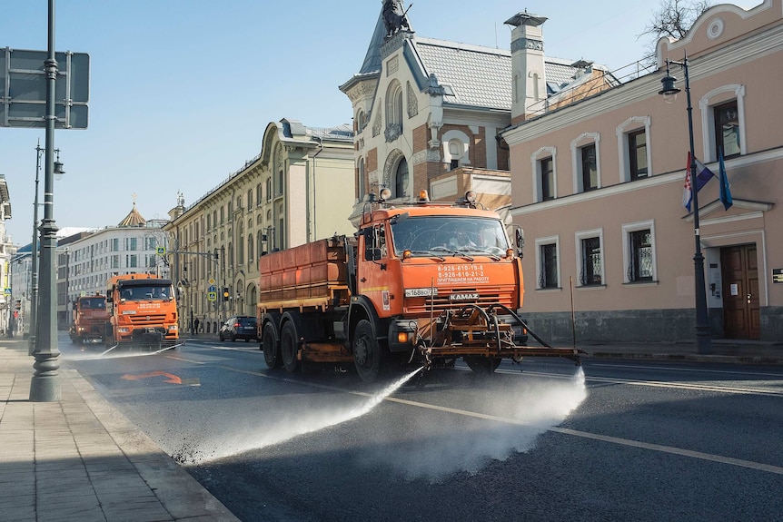 A truck sprays the street in Moscow.