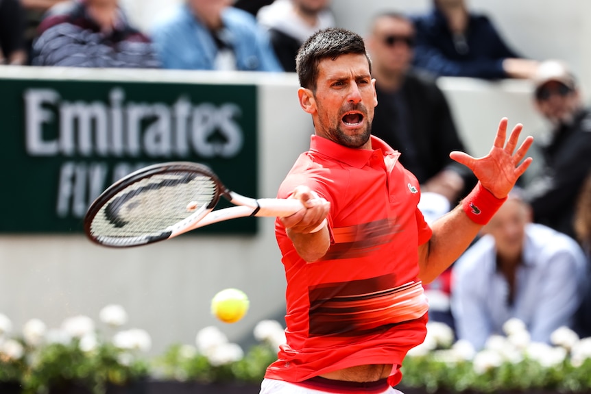 Novak Djokovic plays a forehand against Diego Schwatzman at the French Open 2022