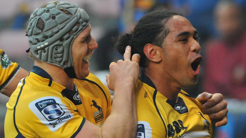 The Brumbies Joe Tomane (R) celebrates a try against the Stormers in Super Rugby qualifying final.