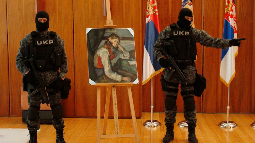 Serbian special police guard what is believed to be an impressionist masterpiece Boy in a Red Waistcoat by Paul Cezanne in Belgrade on April 12, 2012. Police in Serbia believe they have recovered the Cezanne masterpiece, worth at least $109 million, that was stolen at gunpoint in one of the world's biggest art heists four years ago. The canvas was one of four paintings stolen from a Swiss art gallery in 2008 by a trio of masked robbers who burst in just before closing time and told staff to lay on the floor while they took what they wanted.