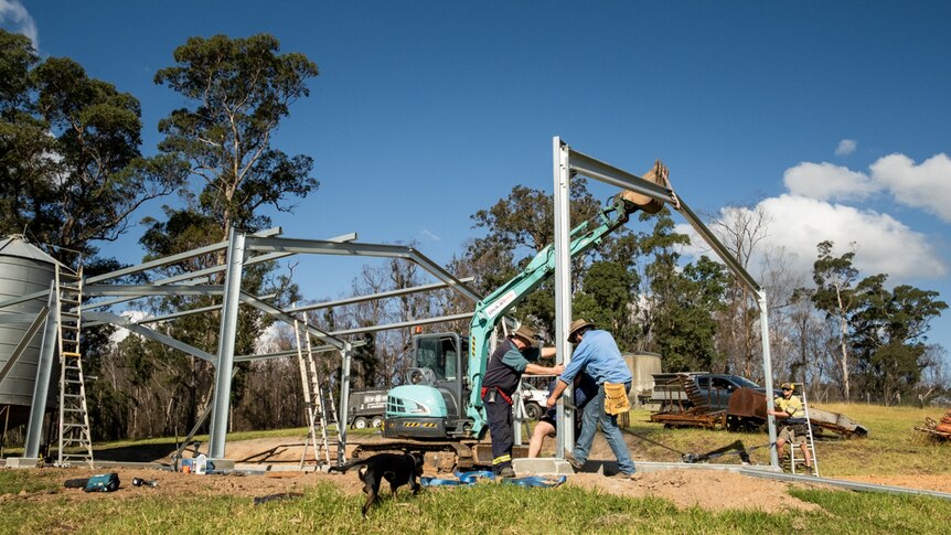 Warren Salway helping put up a new shed