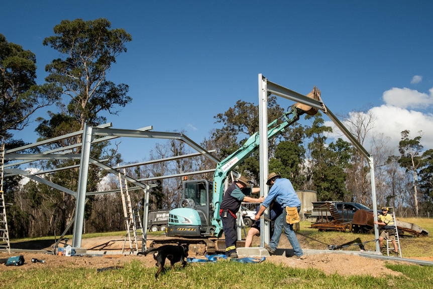 Warren Salway helping put up a new shed