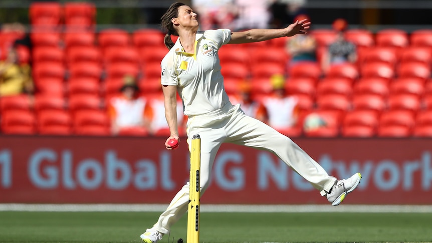 Ellyse Perry is depicted mid bowling action in a test match against India in 2021