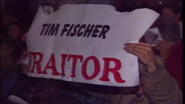 A sign says Tim Fischer traitor.
