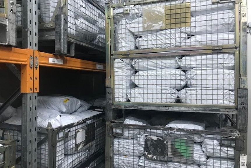 Cages full of white packages.