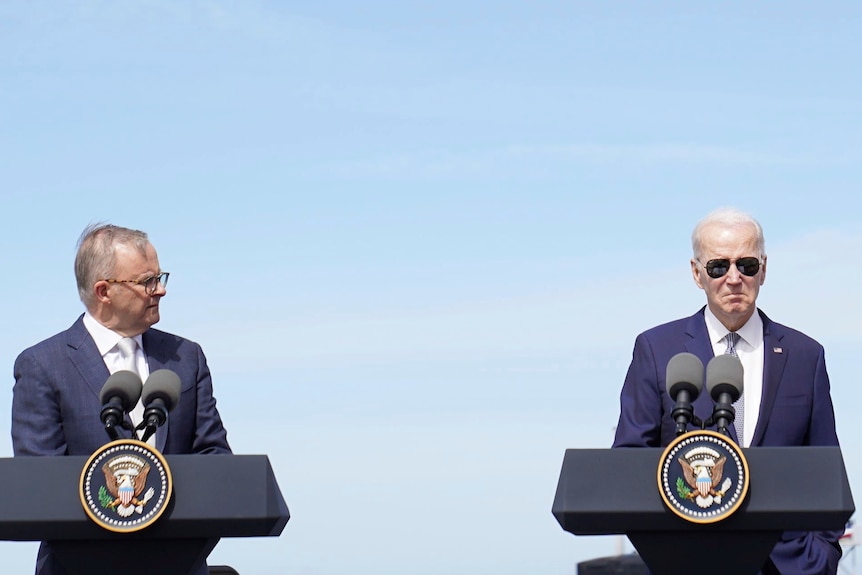 Anthony Albanese looking at Joe Biden, who's in aviators 